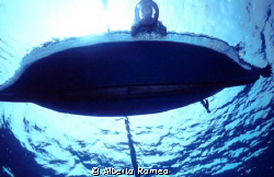A sicilyan fisherman fishing with his little boat and anc... by Alberto Romeo 